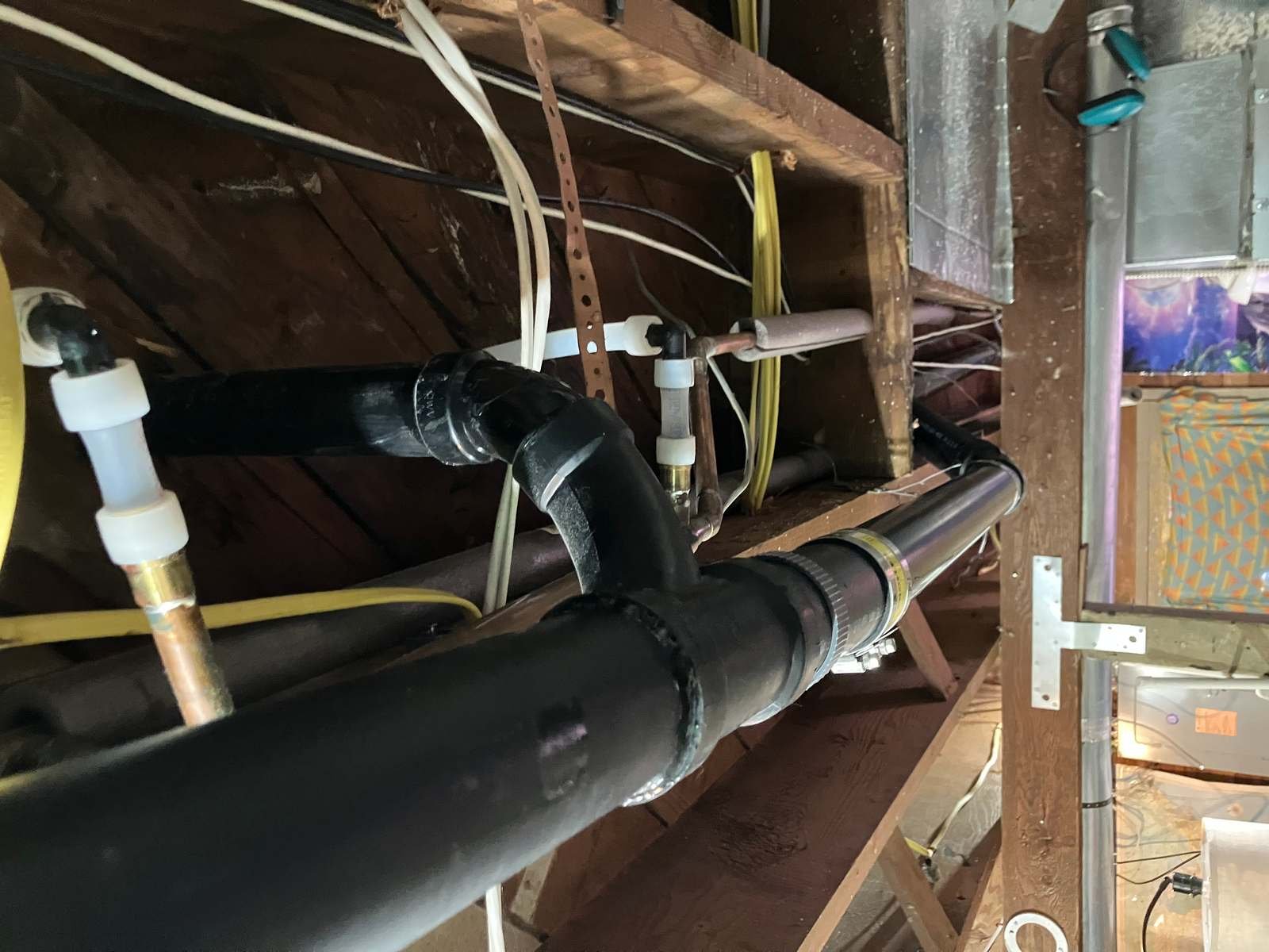 ABS drain stack rerouted through floor joists by Andy's Plumbing & Drain