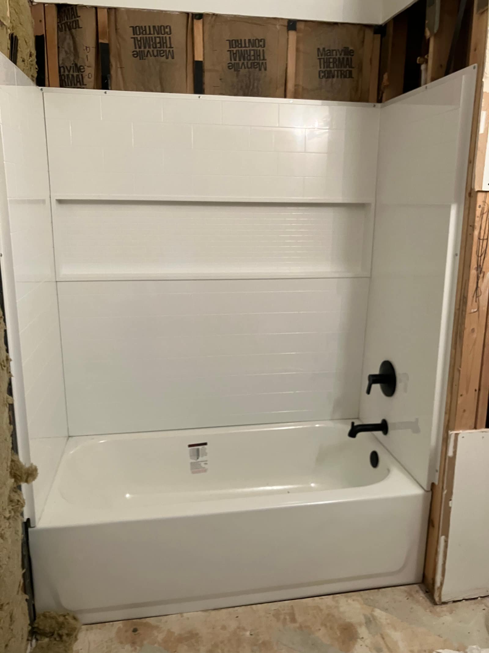 Tub and surround installation in progress